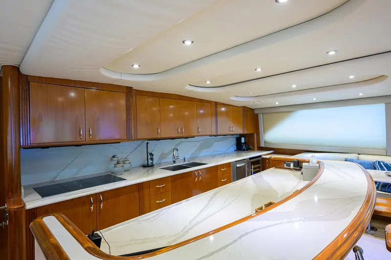 Jr Yacht Photos Pics Luxurious kitchen interior of 2004 Sea Force IX 82 Enclosed Bridge yacht with wooden cabinetry.