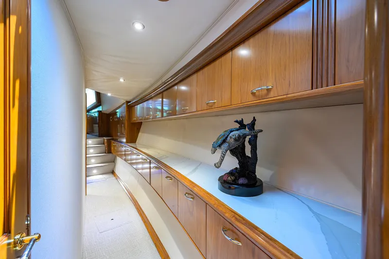 Jr Yacht Photos Pics Luxurious interior of 2004 Sea Force IX 82 Enclosed Bridge yacht with elegant wood cabinetry.