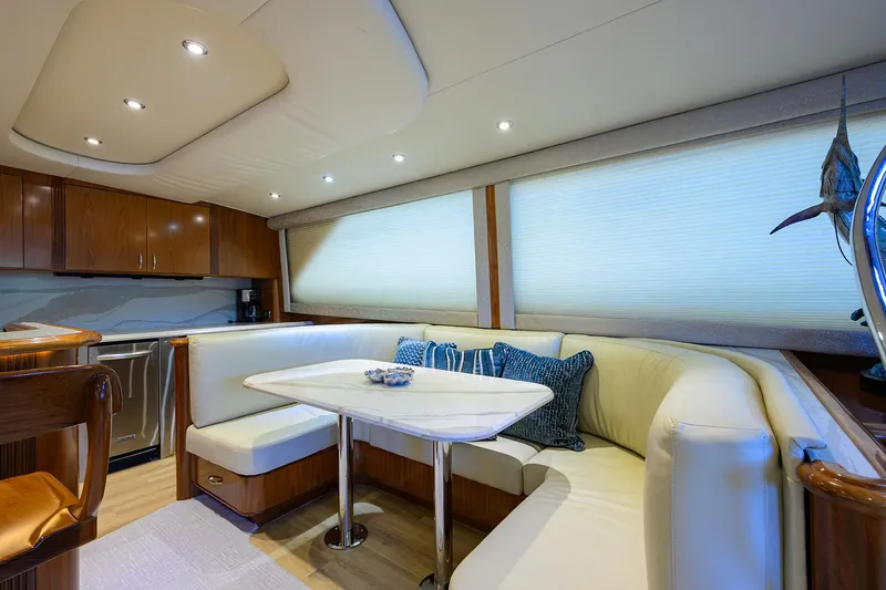 Jr Yacht Photos Pics Luxurious interior of 2004 Sea Force IX 82 Enclosed Bridge yacht with elegant seating area.