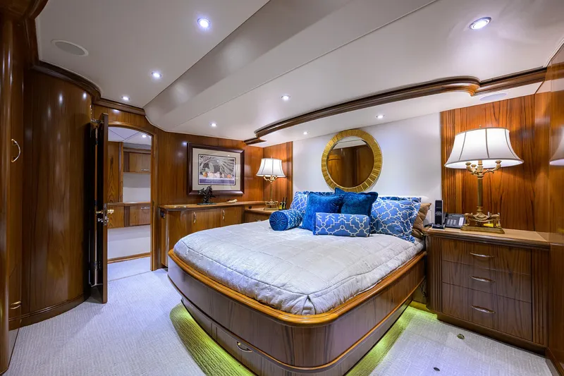 Jr Yacht Photos Pics Luxurious bedroom interior of 2004 Sea Force IX 82 Enclosed Bridge yacht, featuring elegant wood finishes.