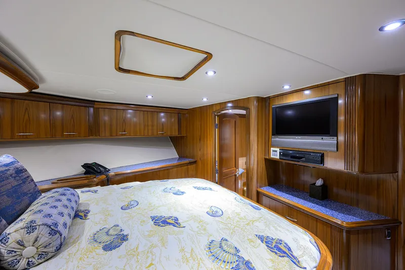 Jr Yacht Photos Pics Luxurious cabin interior of 2004 Sea Force IX 82 Enclosed Bridge yacht with wood paneling.