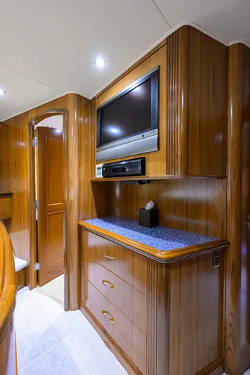 Jr Yacht Photos Pics Luxurious wooden interior of 2004 Sea Force IX 82 Enclosed Bridge yacht with TV and storage.