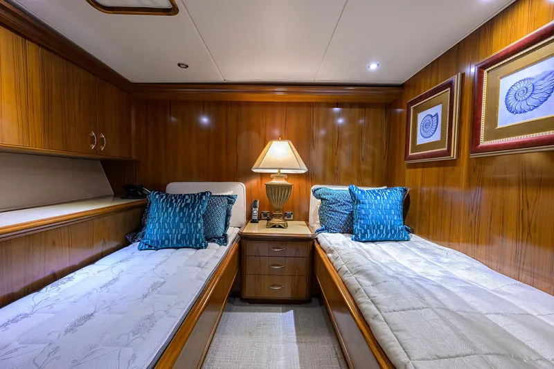 Jr Yacht Photos Pics Luxurious twin cabin on 2004 Sea Force IX 82 Enclosed Bridge yacht with elegant wood paneling.