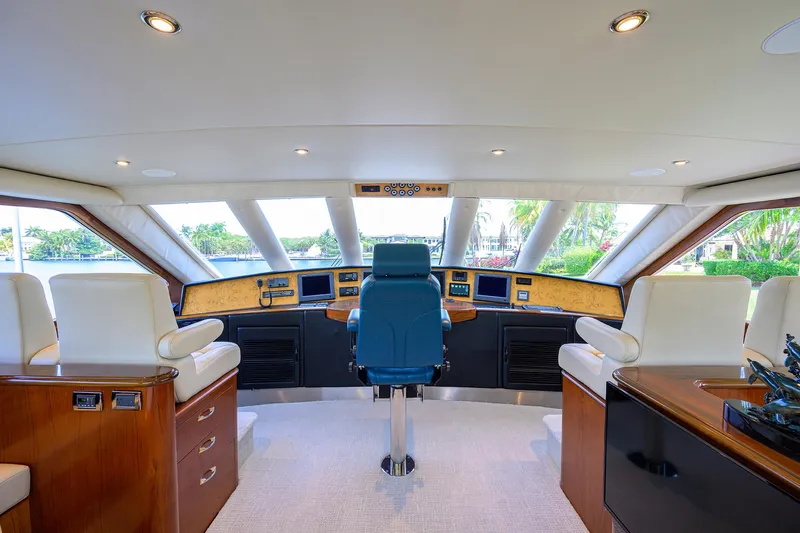 Jr Yacht Photos Pics Luxurious helm of 2004 Sea Force IX 82 Enclosed Bridge yacht with panoramic windows.