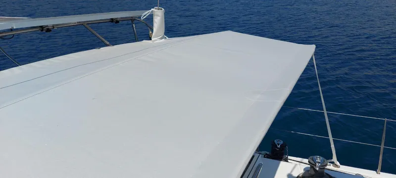  Yacht Photos Pics Sailing yacht Hanse 461 (2006) with sunshade, cruising on calm blue waters.