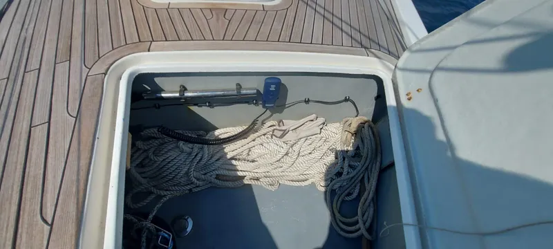  Yacht Photos Pics Open storage compartment on 2006 Hanse 461 yacht deck with ropes inside.