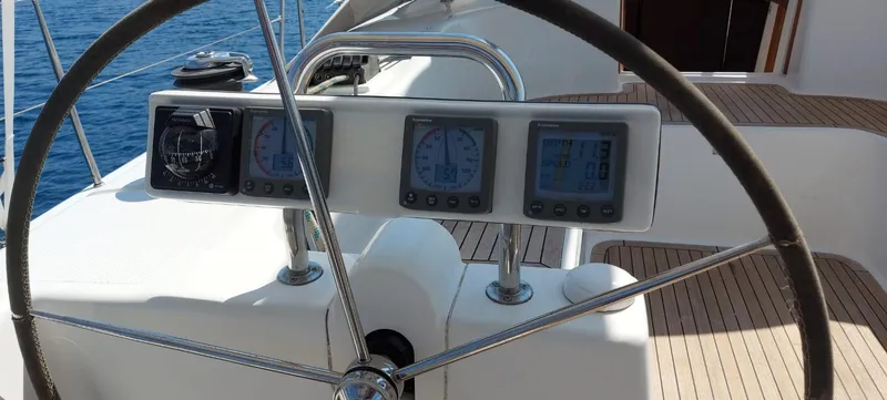  Yacht Photos Pics Steering wheel and navigation instruments on a 2006 Hanse 461 sailboat.