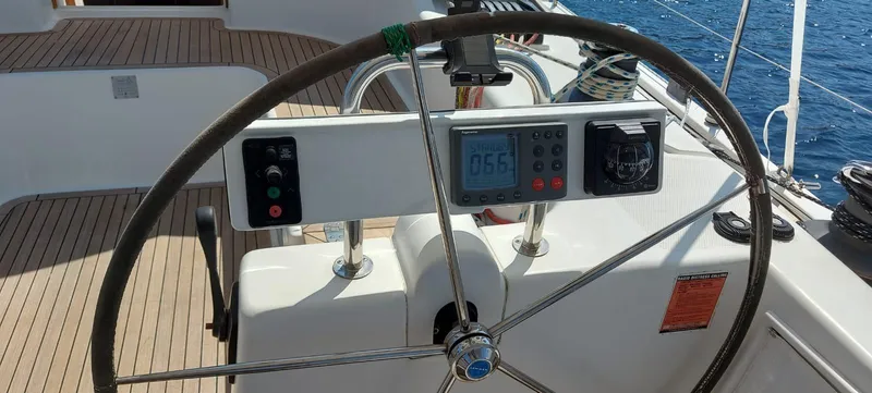  Yacht Photos Pics Steering wheel of a 2006 Hanse 461 yacht with navigation instruments, sailing on open water.