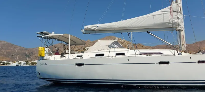  Yacht Photos Pics Sailing yacht Hanse 461, 2006 model, anchored in a scenic coastal bay.