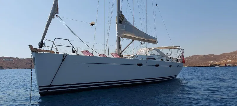  Yacht Photos Pics 2006 Hanse 461 sailboat anchored in calm blue waters, clear sky background.