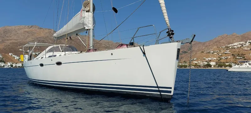  Yacht Photos Pics 2006 Hanse 461 sailboat anchored in scenic coastal waters.