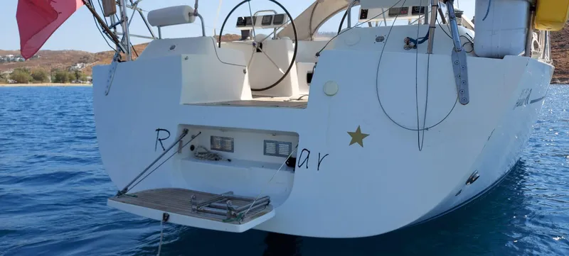  Yacht Photos Pics Stern view of 2006 Hanse 461 yacht on calm blue water.