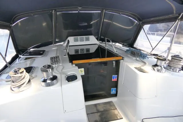 Ale Er Ron Yacht Photos Pics Interior view of 2000 Hunter 460 sailboat cockpit with winches and ropes.