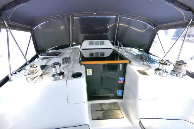 Ale Er Ron Yacht Photos Pics Interior cockpit of 2000 Hunter 460 sailboat with ropes and controls.