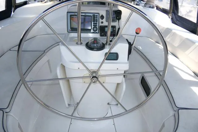 Ale Er Ron Yacht Photos Pics Steering wheel and navigation console of 2000 Hunter 460 sailboat.
