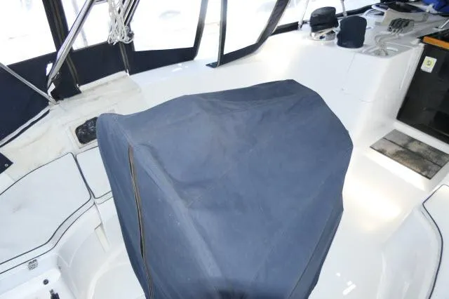 Ale Er Ron Yacht Photos Pics Interior of 2000 Hunter 460 sailboat with covered helm and seating area.