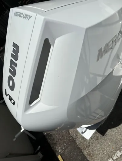 Wcn 51988 325dc Wht Mer350 Yacht Photos Pics Close-up of a 2024 World Cat 325 DC with a Mercury V10 outboard engine.