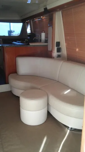 First Light Yacht Photos Pics Luxurious interior of a 2005 Sea Ray 550 Sedan Bridge yacht with leather seating.