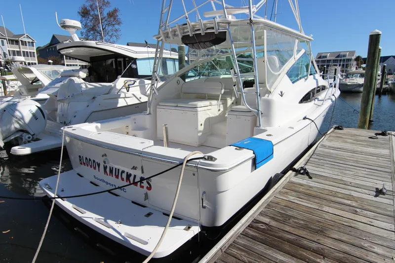 Bloody Knuckles Yacht Photos Pics 2008 Bertram 360 boat docked at marina, named "Bloody Knuckles," Southport, NC.