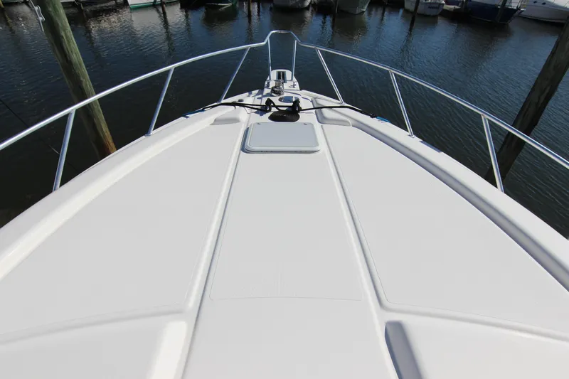 Bloody Knuckles Yacht Photos Pics Bow view of a 2008 Bertram 360 yacht docked at a marina.