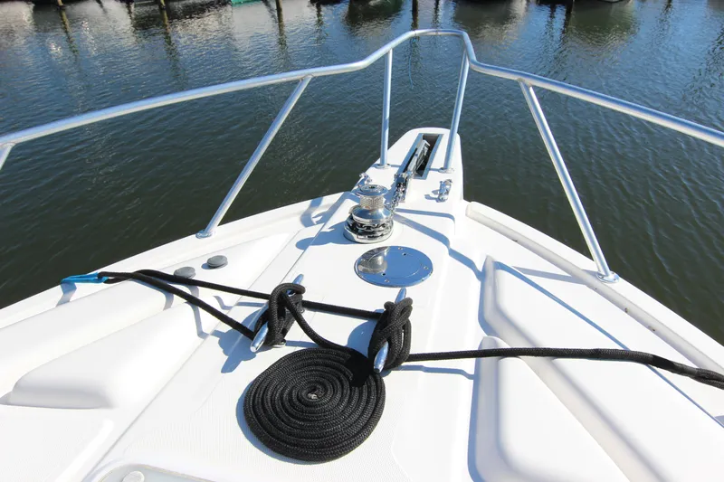 Bloody Knuckles Yacht Photos Pics Bow of 2008 Bertram 360 yacht with railing and mooring line.