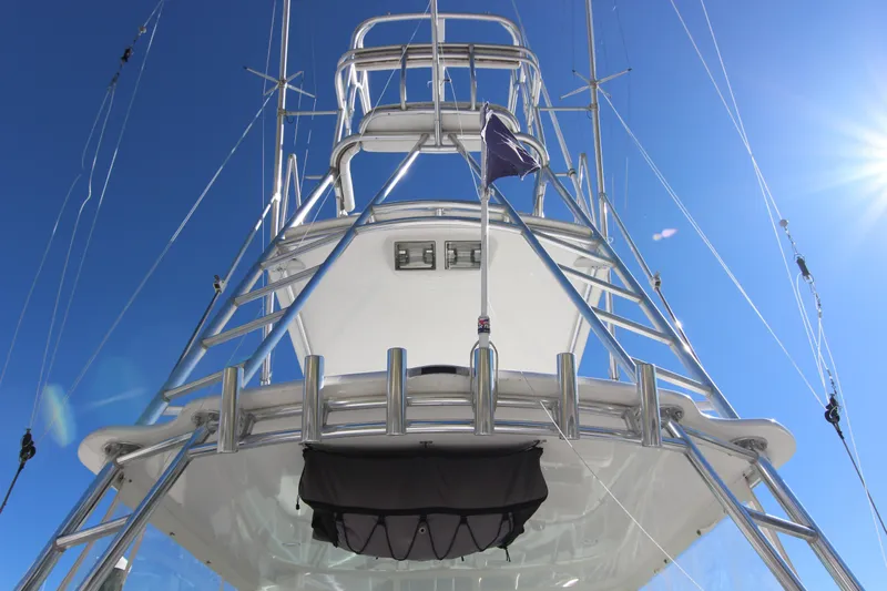 Bloody Knuckles Yacht Photos Pics 2008 Bertram 360 yacht tower against clear blue sky, showcasing sleek design and structure.