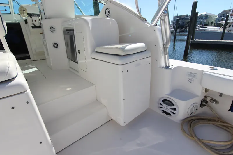 Bloody Knuckles Yacht Photos Pics 2008 Bertram 360 yacht interior with seating, steps, and marina view.