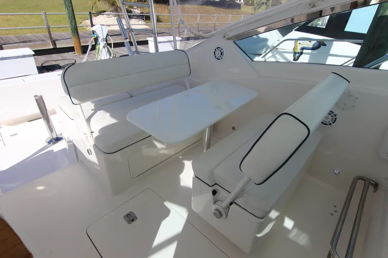 Bloody Knuckles Yacht Photos Pics 2008 Bertram 360 yacht interior with white seating and table setup.