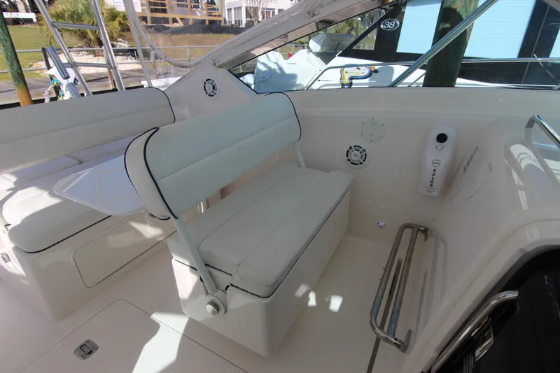 Bloody Knuckles Yacht Photos Pics Interior of a 2008 Bertram 360 yacht with white seating and modern amenities.
