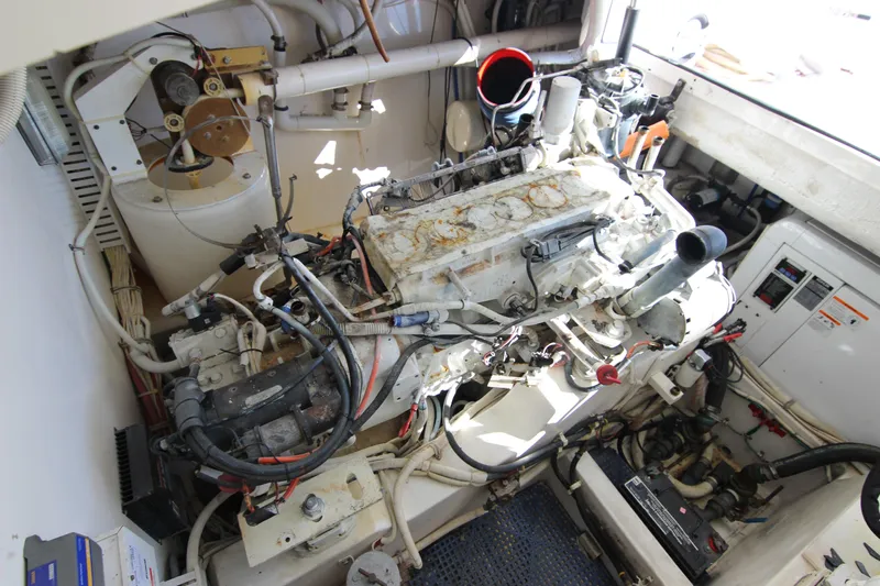 Bloody Knuckles Yacht Photos Pics Engine room of a 2008 Bertram 360 boat, showcasing mechanical components and wiring.