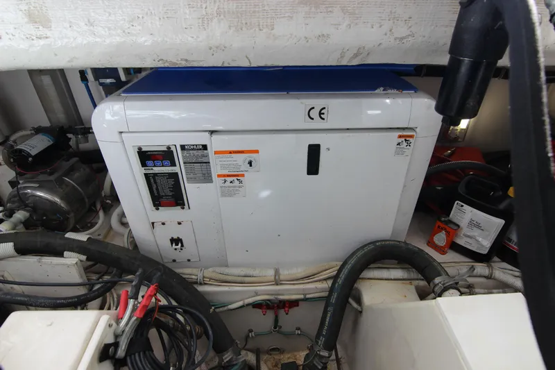 Bloody Knuckles Yacht Photos Pics Engine room of a 2008 Bertram 360 with Kohler generator and various equipment.