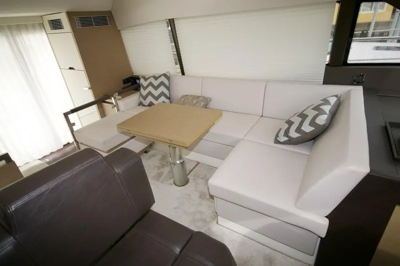Skylark Yacht Photos Pics Luxurious interior of 2018 Prestige 460 S yacht with modern seating and table.