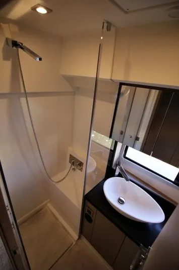 Skylark Yacht Photos Pics Modern bathroom in 2018 Prestige 460 S yacht with shower and sleek sink design.