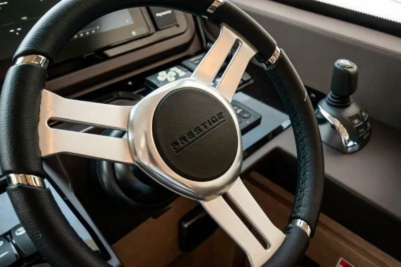 Skylark Yacht Photos Pics Steering wheel of 2018 Prestige 460 S yacht, showcasing sleek design and modern controls.