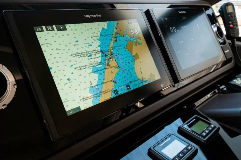 Skylark Yacht Photos Pics Navigation system on 2018 Prestige 460 S yacht dashboard, featuring Raymarine displays.