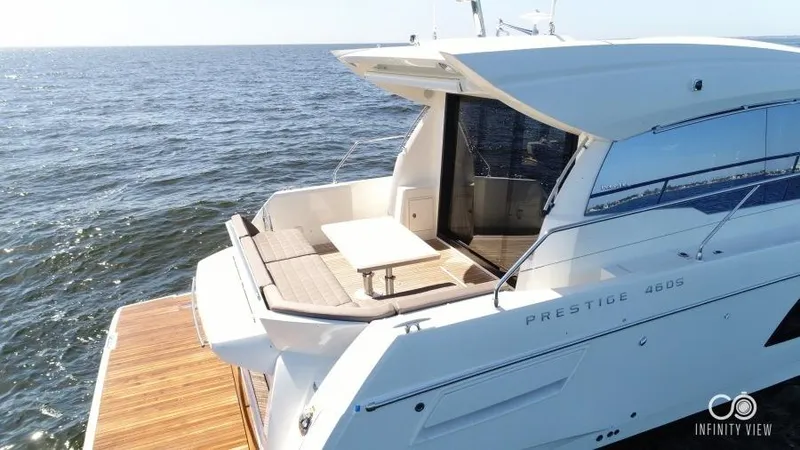 Skylark Yacht Photos Pics 2018 Prestige 460 S yacht on water, featuring sleek design and spacious deck.