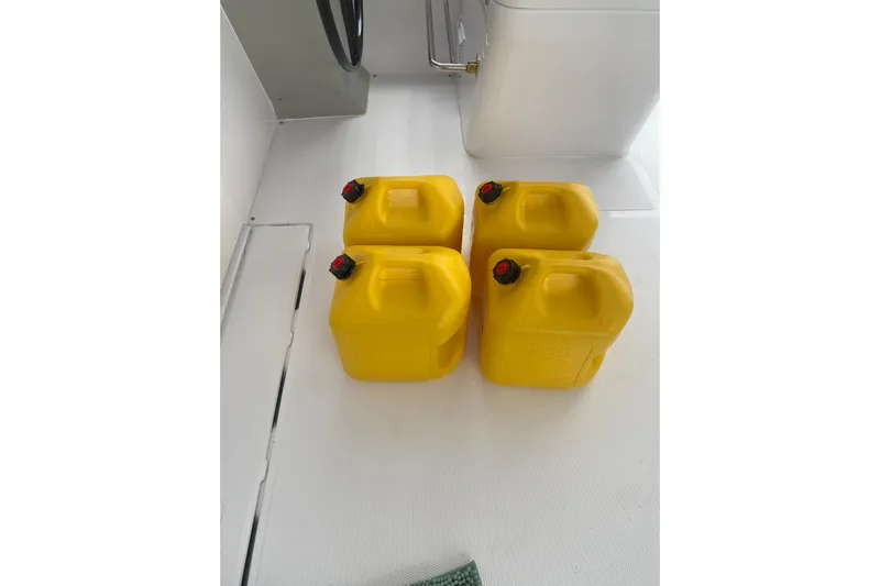 Dauntless Yacht Photos Pics Four yellow fuel containers on a Seawind 1370 boat deck, 2024 model.