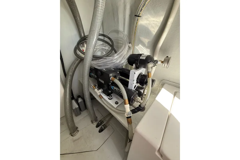 Dauntless Yacht Photos Pics 2024 Seawind 1370 yacht interior with water filtration system and hoses.