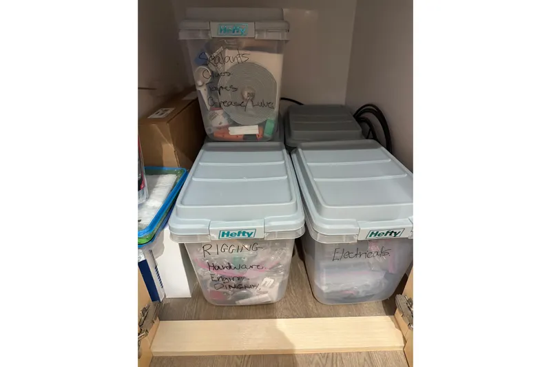 Dauntless Yacht Photos Pics Storage bins labeled for rigging, electricals, and sealants on a Seawind 1370 yacht, 2024 model.