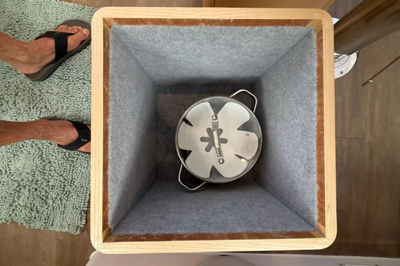 Dauntless Yacht Photos Pics Interior view of Seawind 1370 (2024) with a pot in a lined storage compartment.