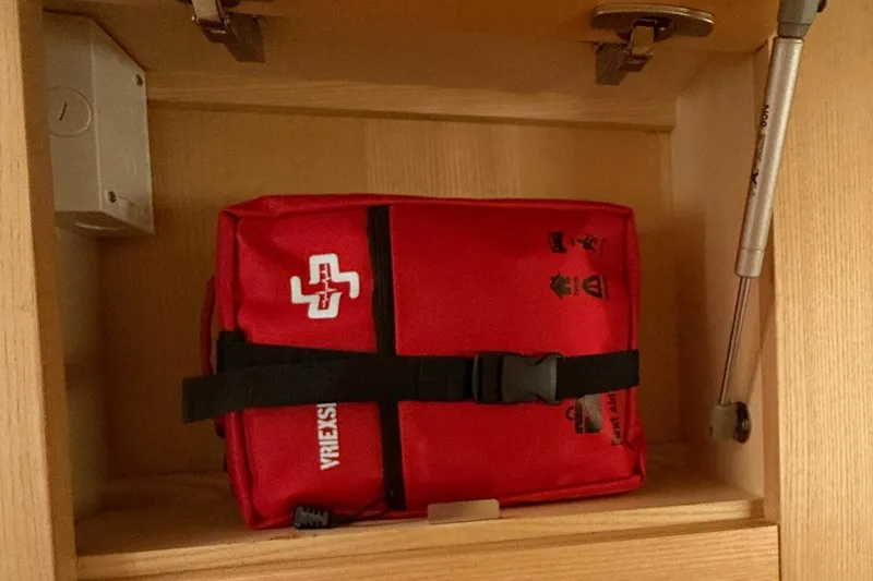 Dauntless Yacht Photos Pics Red first aid kit inside Seawind 1370 yacht cabinet, 2024 model.