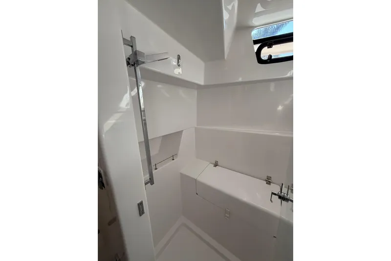 Dauntless Yacht Photos Pics 2024 Seawind 1370 yacht interior, featuring sleek white bathroom design with modern fixtures.