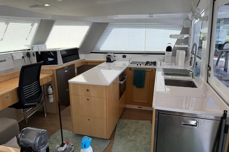 Dauntless Yacht Photos Pics Modern kitchen interior of 2024 Seawind 1370 yacht with sleek design and appliances.