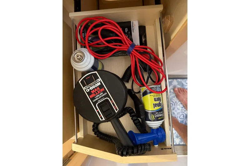 Dauntless Yacht Photos Pics Drawer with boating equipment, including cables and a signal horn, on a 2024 Seawind 1370.