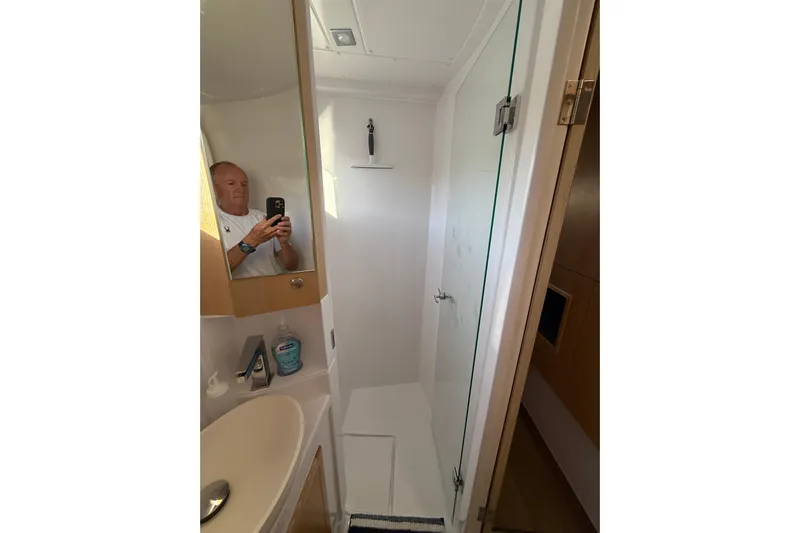 Dauntless Yacht Photos Pics Bathroom interior of 2024 Seawind 1370 yacht with shower and sink.