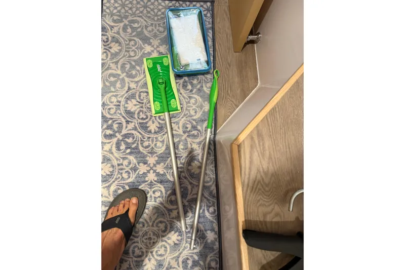 Dauntless Yacht Photos Pics Cleaning tools on patterned carpet in Seawind 1370, 2024 model.