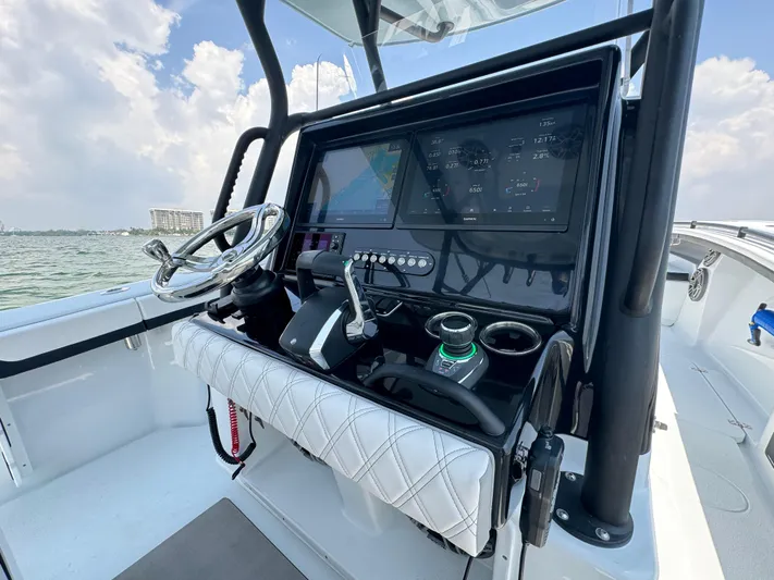  Yacht Photos Pics 2024 Yellowfin 34 Offshore boat dashboard with modern controls and navigation system.