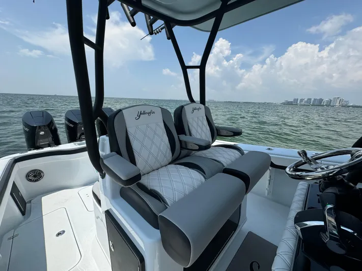  Yacht Photos Pics 2024 Yellowfin 34 Offshore boat interior with luxury seating and ocean view.