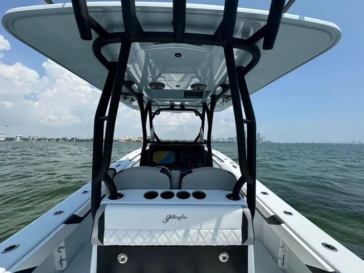  Yacht Photos Pics 2024 Yellowfin 34 Offshore boat on water, featuring sleek design and modern console.
