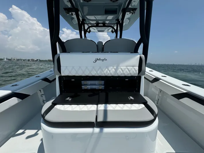  Yacht Photos Pics 2024 Yellowfin 34 Offshore boat interior with seating, on open water.